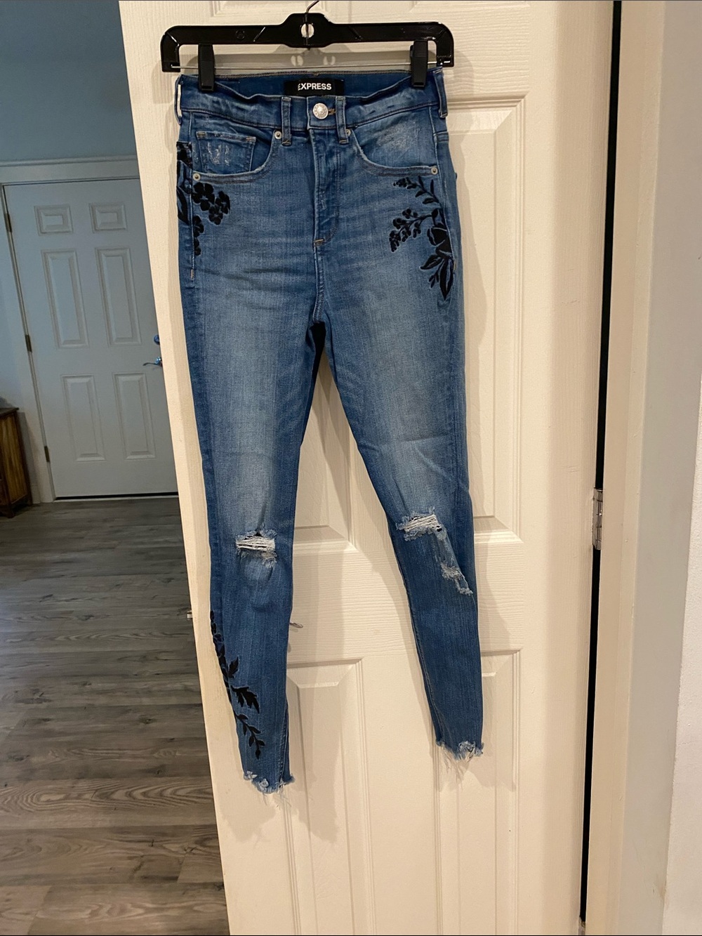 Express Medium Blue Skinny Jeans with Black Floral Appliqué